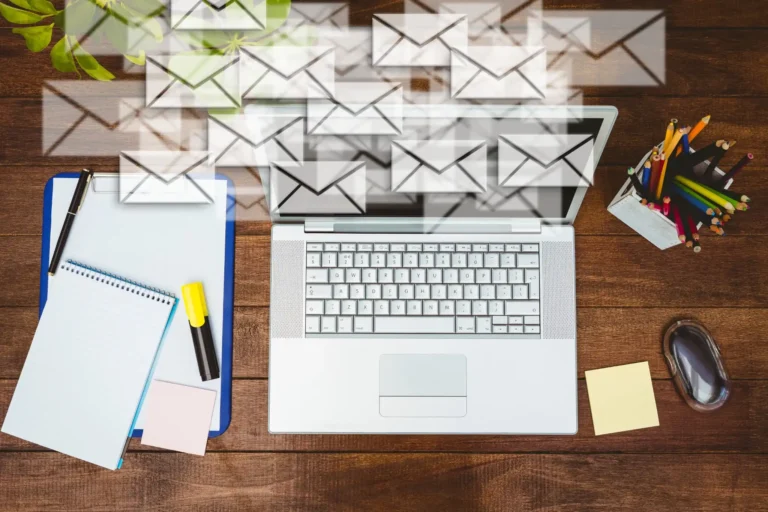 workdesk with envelopes laptop